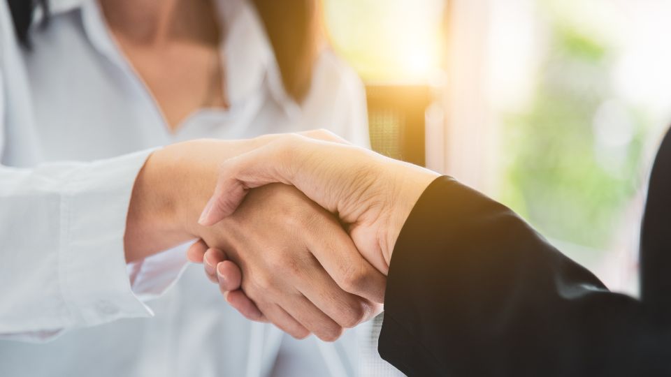 two people shaking hands